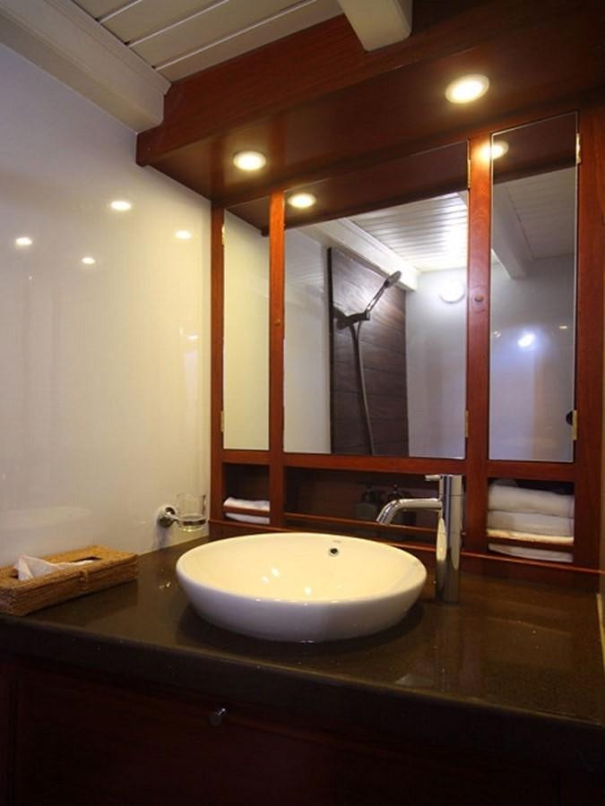 a bathroom with a large mirror aboard AVENTURE Yacht for Sale
