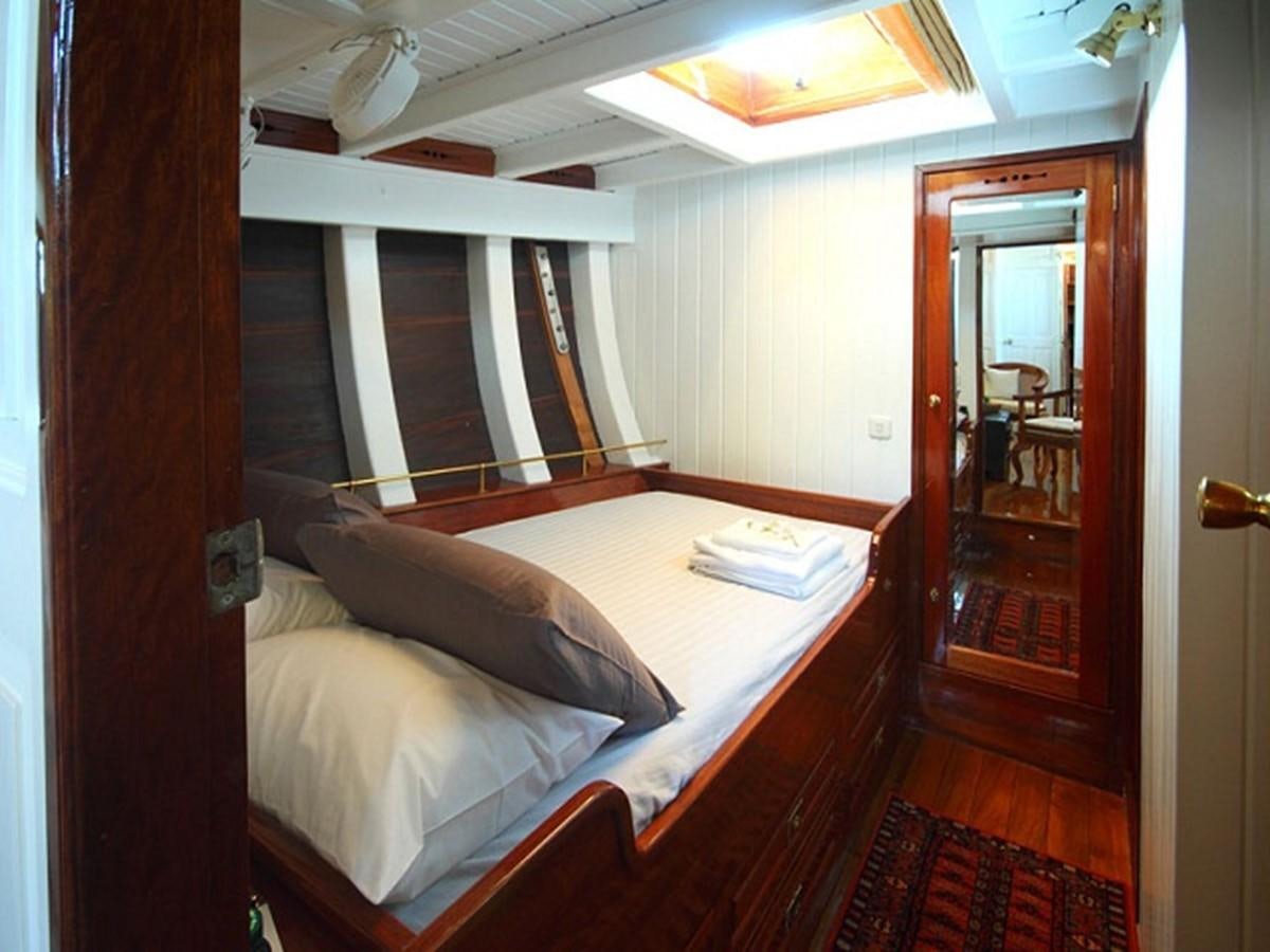 a bed in a room aboard AVENTURE Yacht for Sale