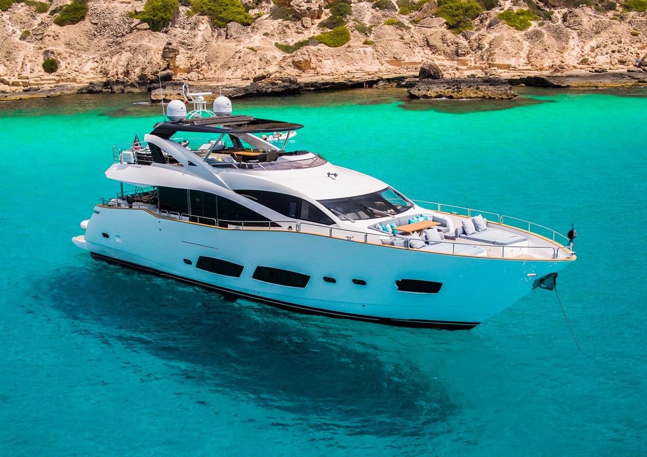 a white yacht in the water aboard SKI Yacht for Sale