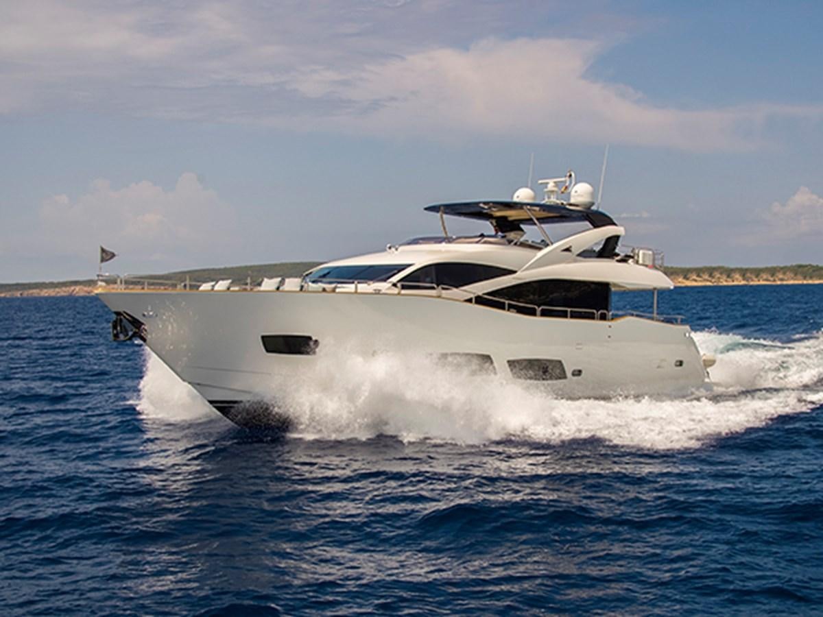 a white yacht on the water aboard SKI Yacht for Sale