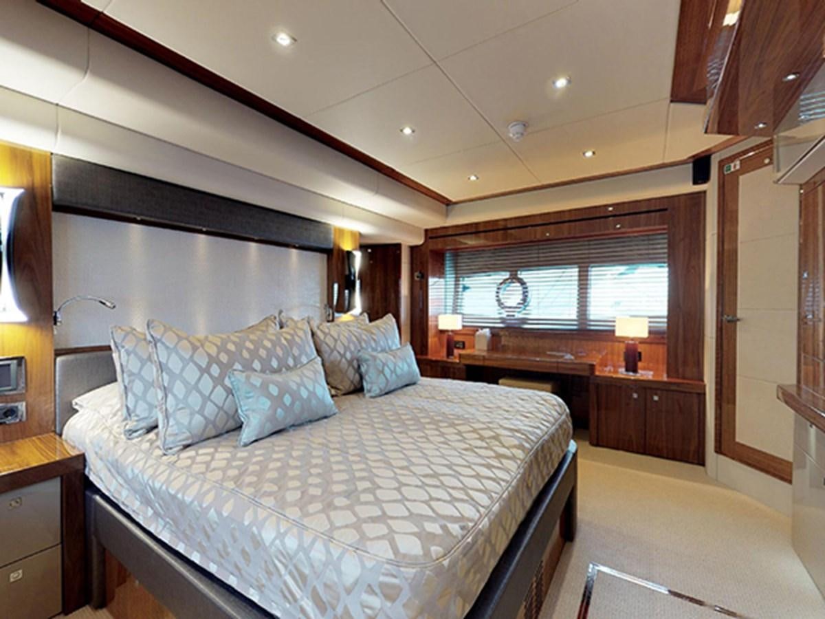a bedroom with a large bed aboard SKI Yacht for Sale