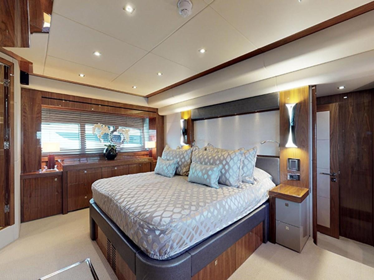 a bedroom with a large bed aboard SKI Yacht for Sale