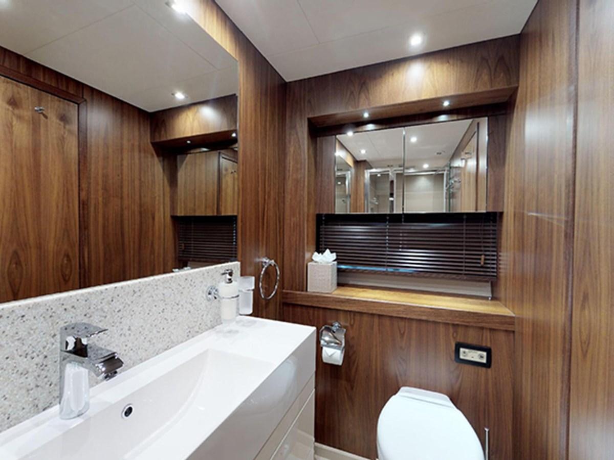 a bathroom with wooden walls aboard SKI Yacht for Sale