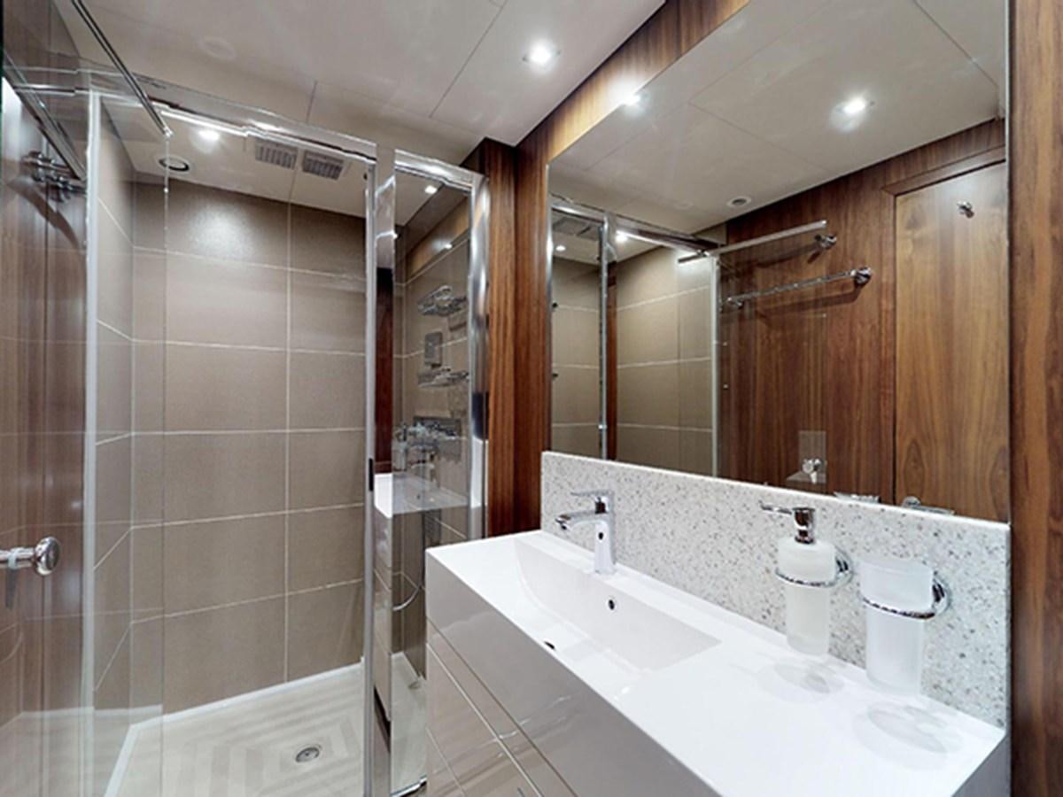 a bathroom with a large mirror aboard SKI Yacht for Sale