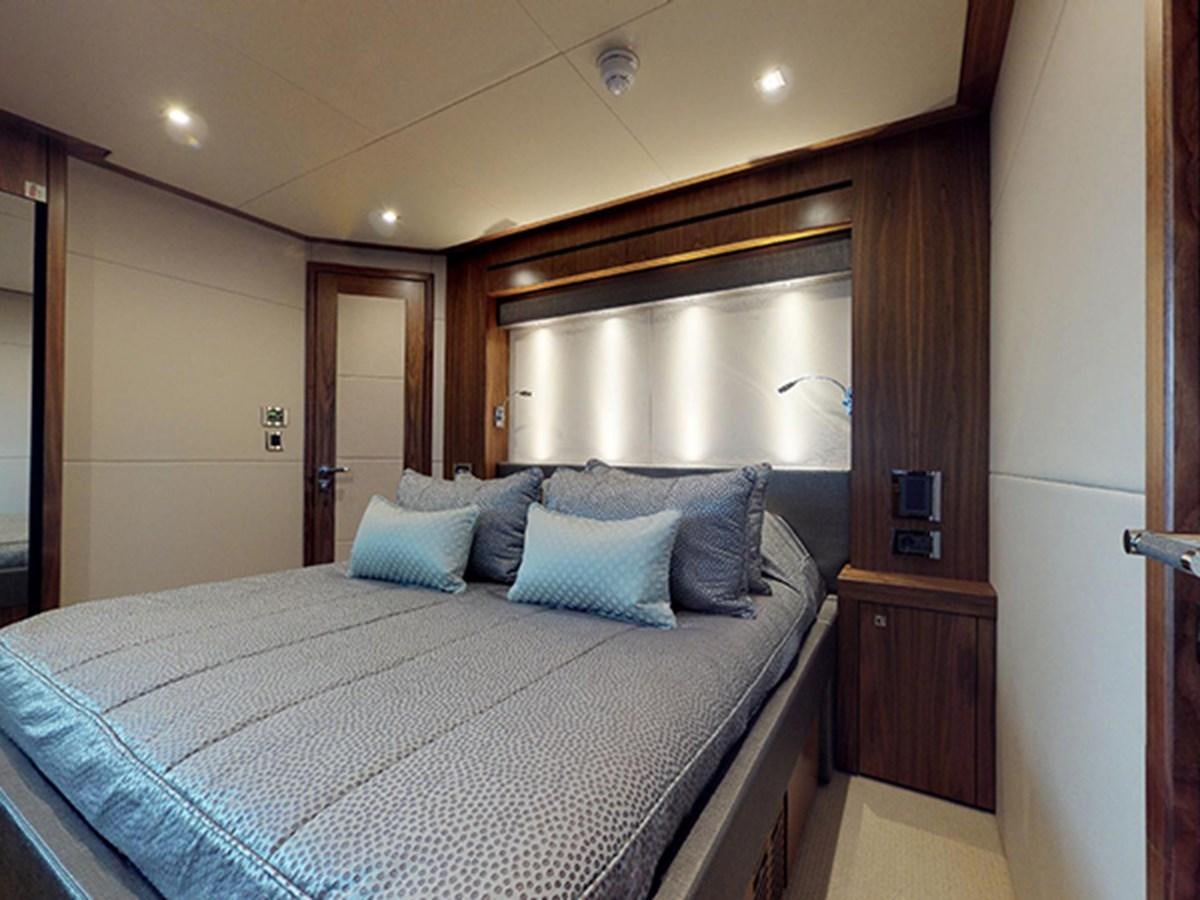 a bed in a hotel room aboard SKI Yacht for Sale