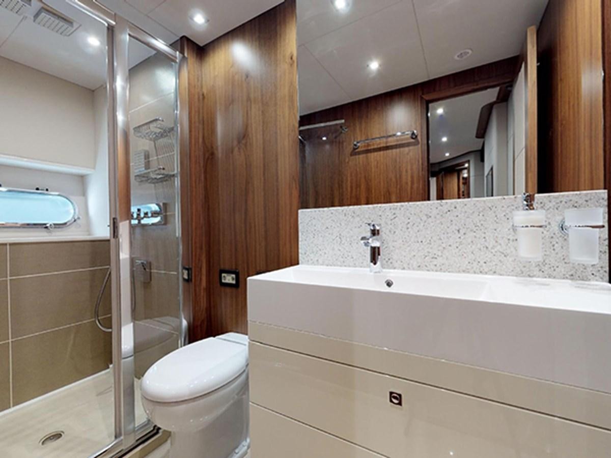 a bathroom with a glass shower aboard SKI Yacht for Sale