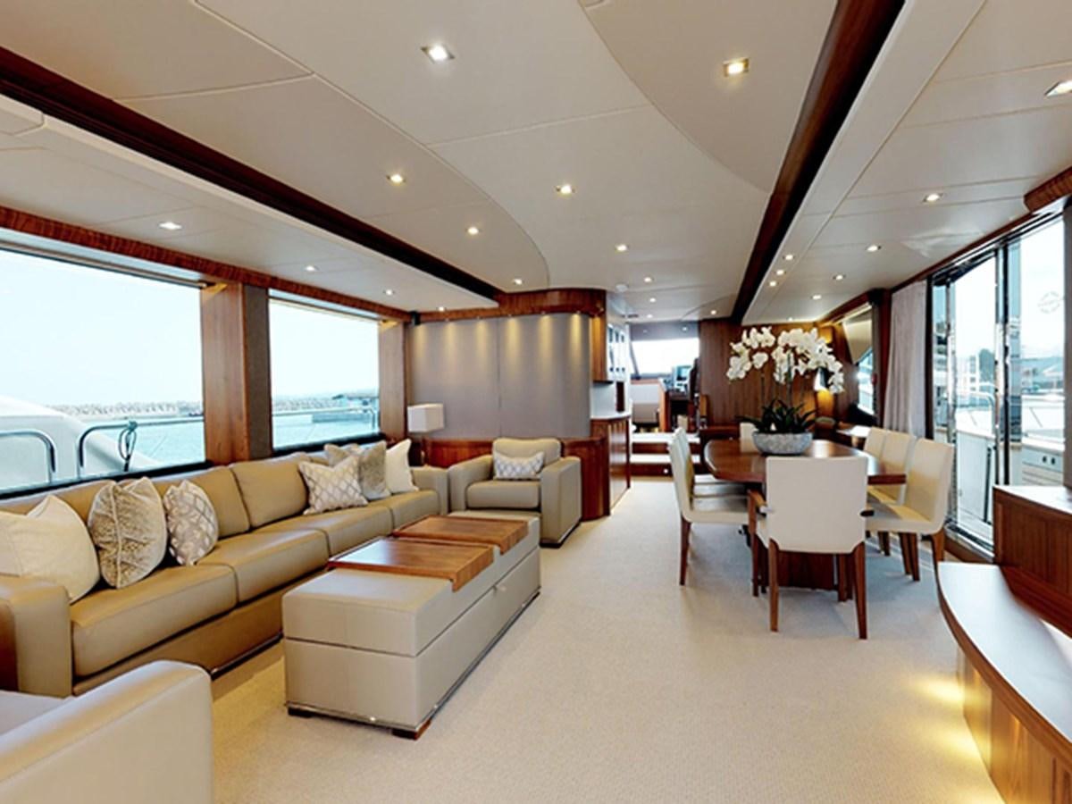 a living room with a couch and a table aboard SKI Yacht for Sale