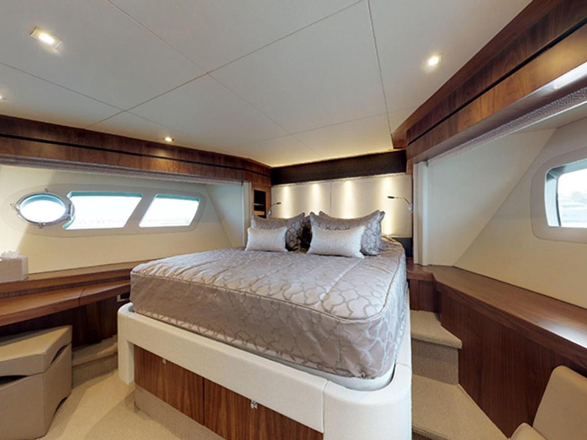 a room with a bed and a window aboard SKI Yacht for Sale