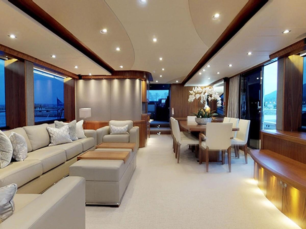 a living room with a couch and a table aboard SKI Yacht for Sale