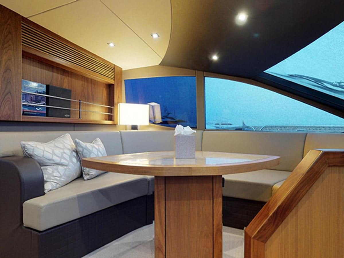 a room with a couch and a table aboard SKI Yacht for Sale