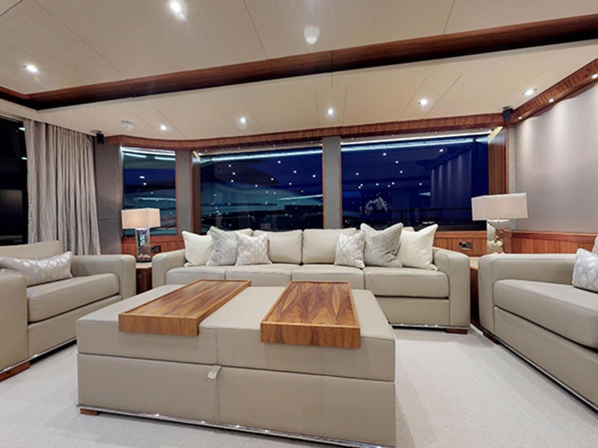a living room with a large window aboard SKI Yacht for Sale