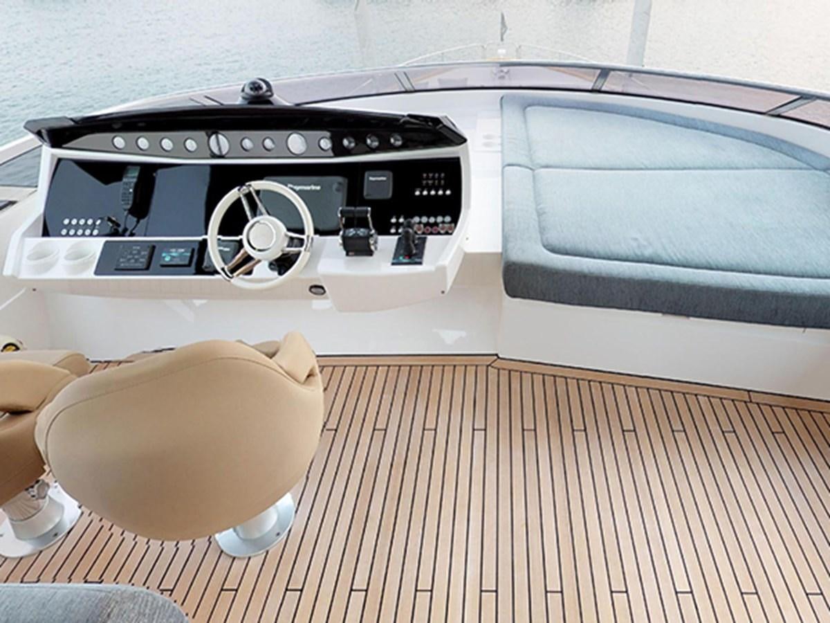 a hand holding a device aboard SKI Yacht for Sale