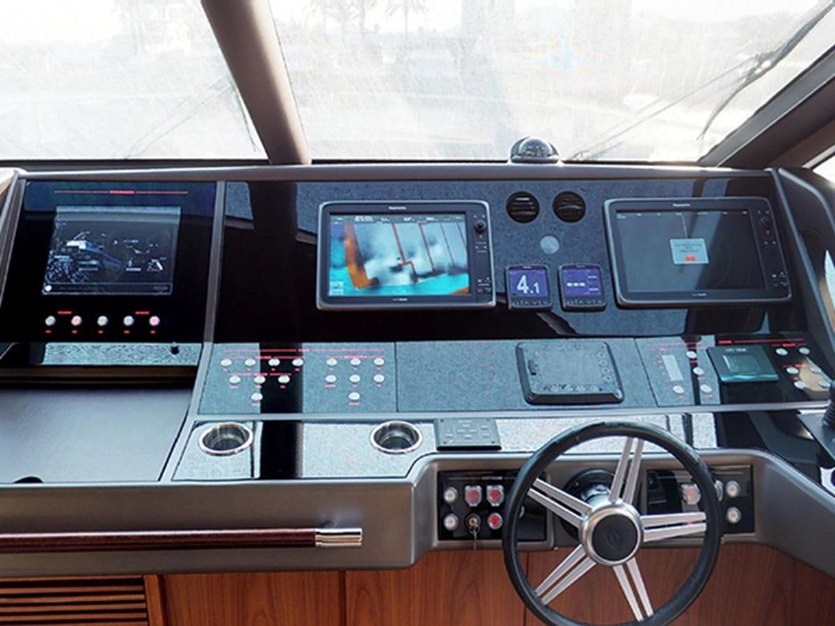 a control panel with a screen aboard SKI Yacht for Sale