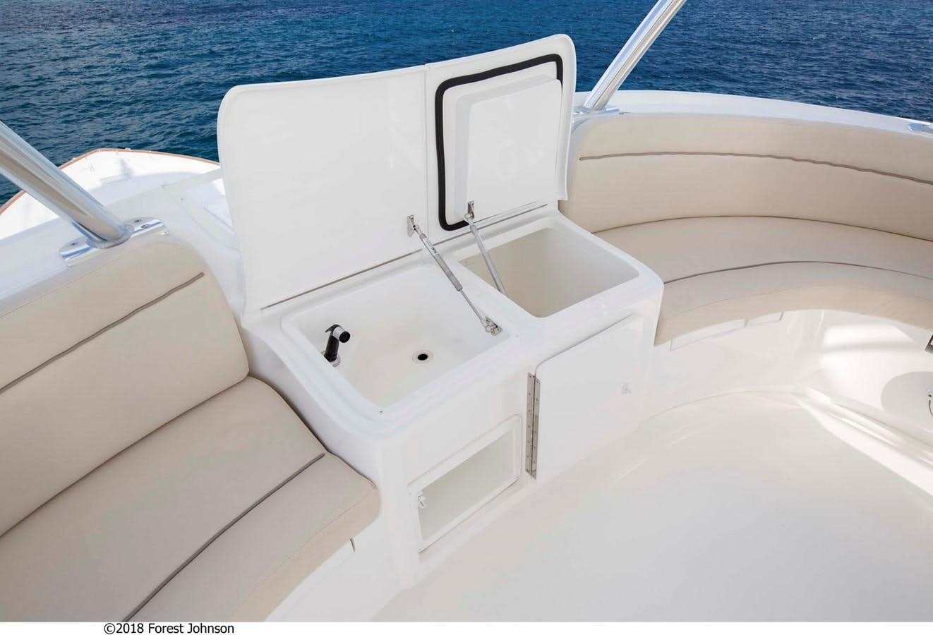 a white boat on a white surface aboard 2022 VIKING 92 ENCLOSED SKYBRIDGE (TBD) Yacht for Sale