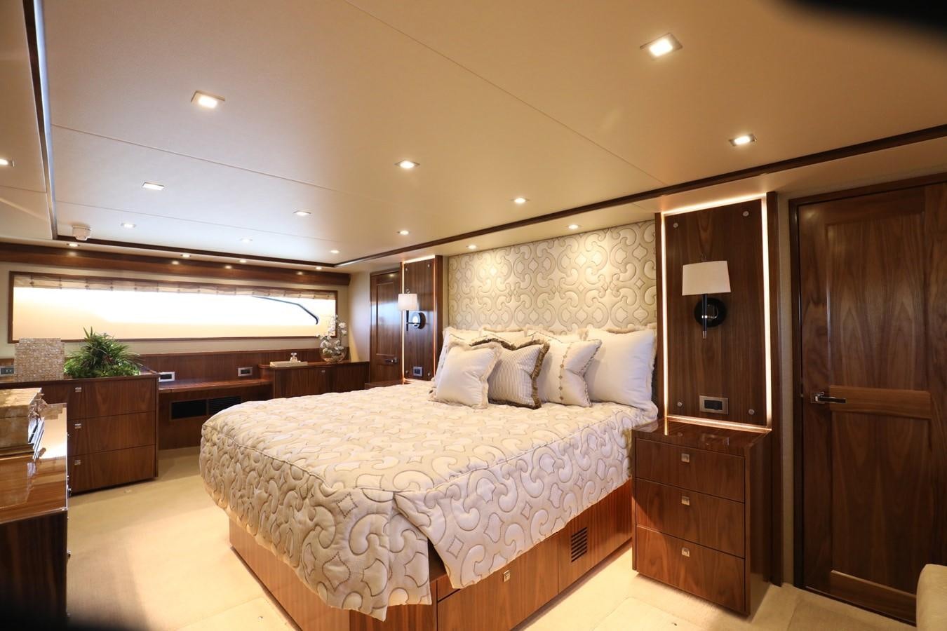 a large bedroom with a large bed aboard 2022 VIKING 92 ENCLOSED SKYBRIDGE (TBD) Yacht for Sale