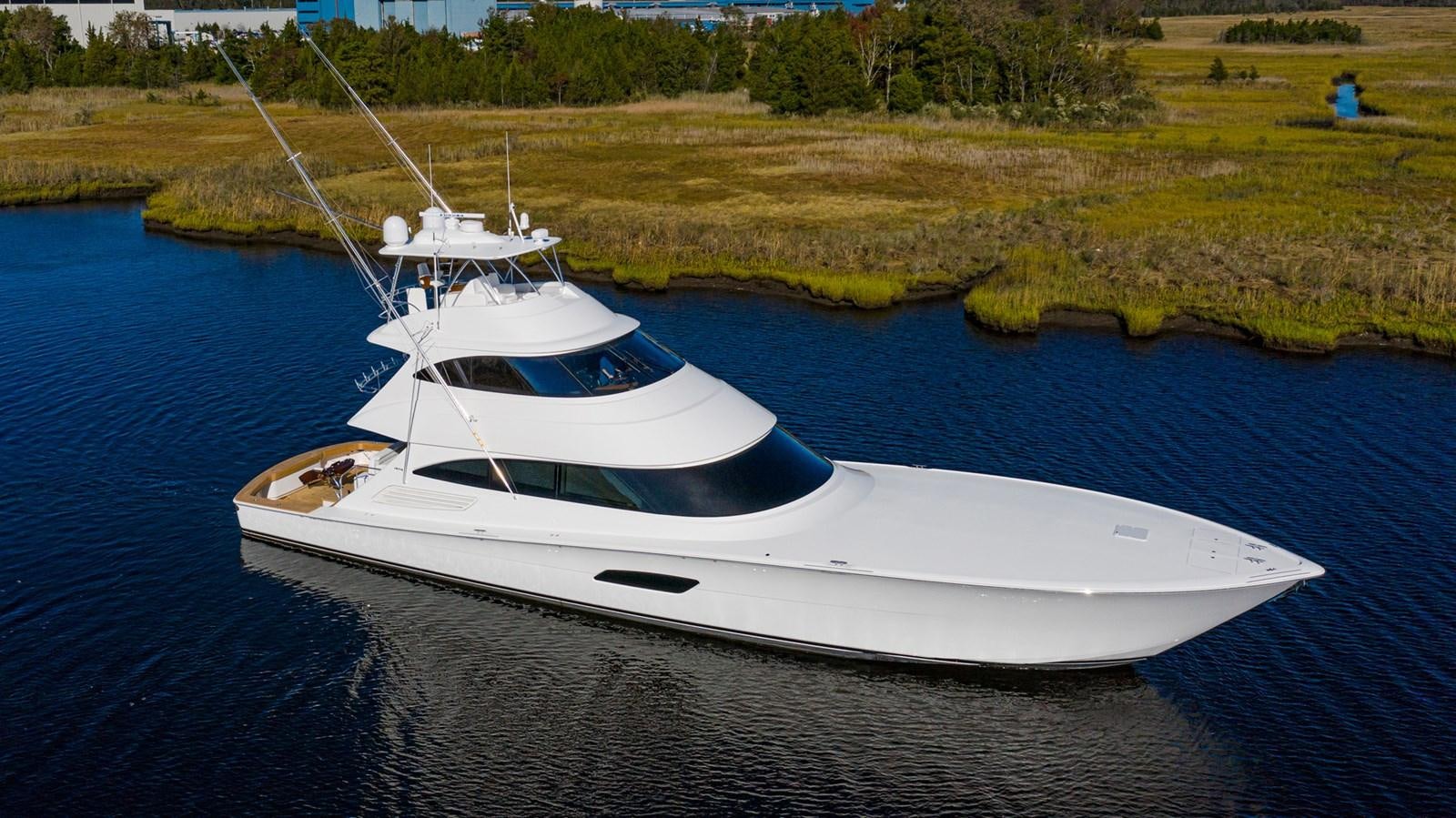 a white boat on the water aboard 2022 VIKING 92 ENCLOSED SKYBRIDGE (TBD) Yacht for Sale