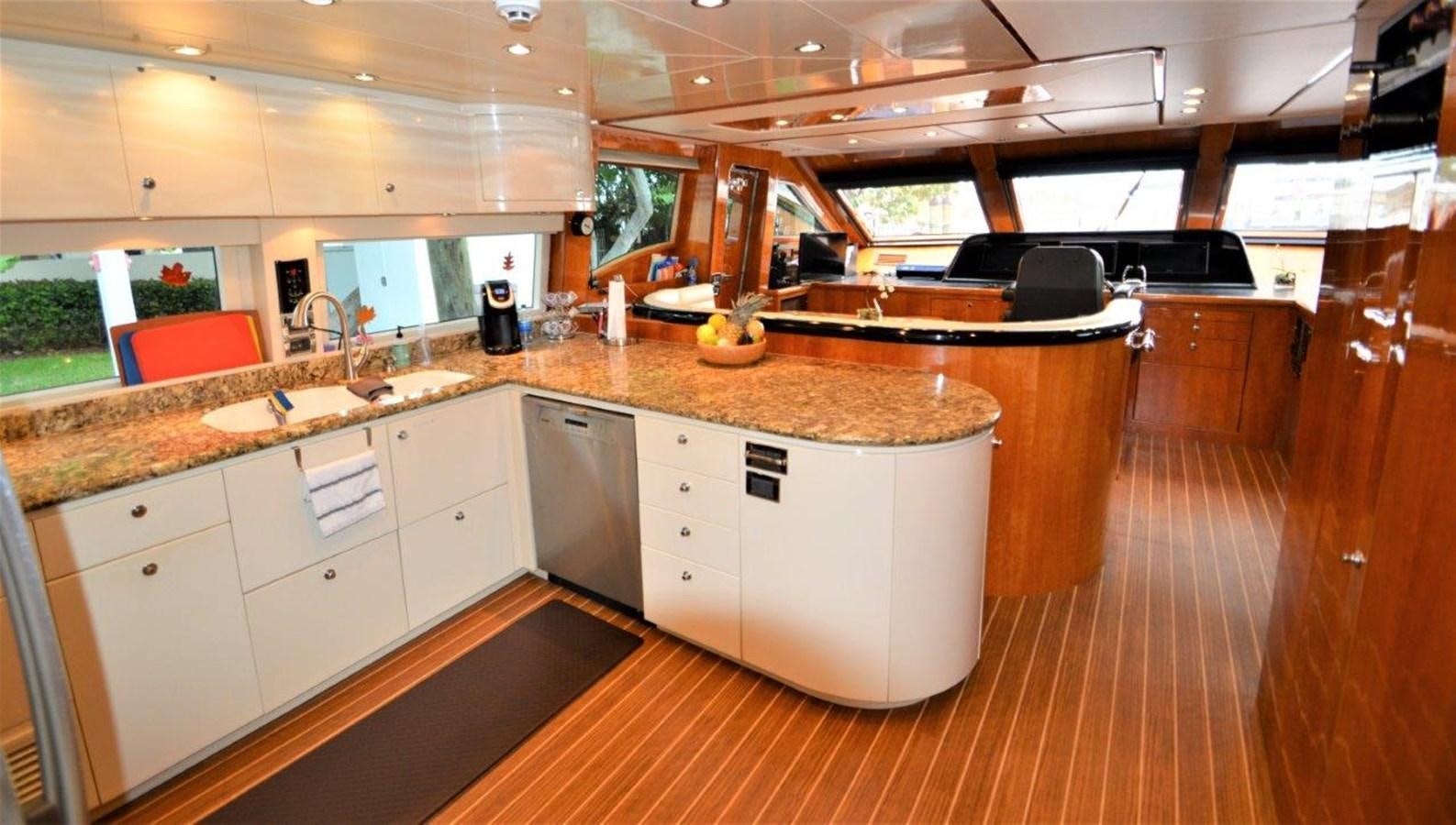 a kitchen with a large island aboard TRIPLE NET Yacht for Sale