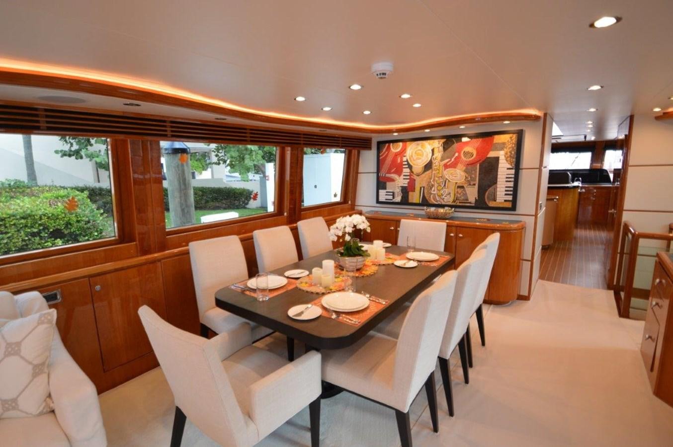 a dining table in a room aboard TRIPLE NET Yacht for Sale