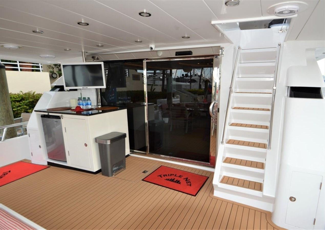 a kitchen with a glass door aboard TRIPLE NET Yacht for Sale