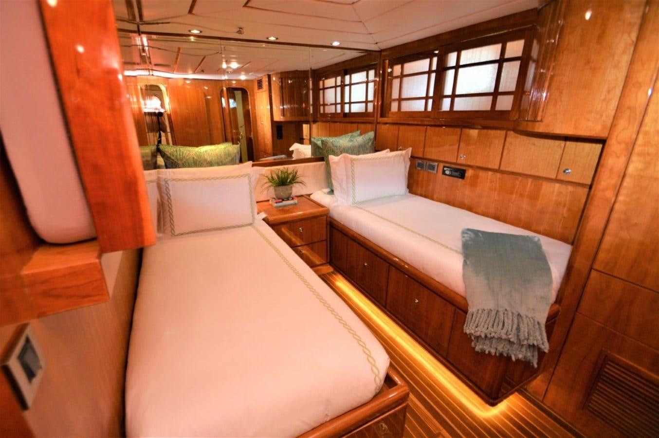 a room with wooden furniture aboard TRIPLE NET Yacht for Sale