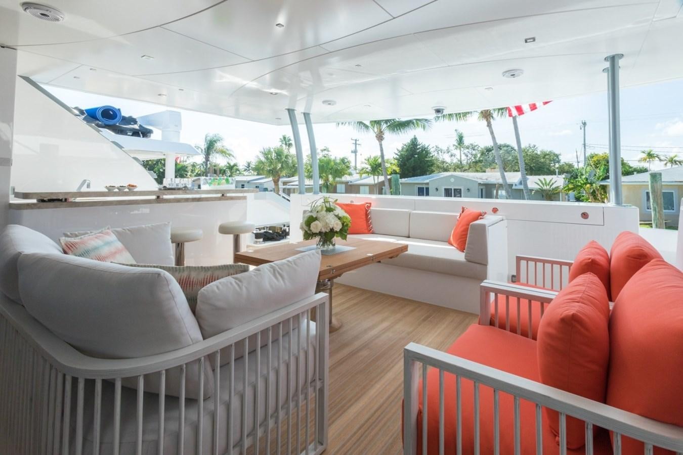 a room with couches and chairs aboard G-G Yacht for Sale
