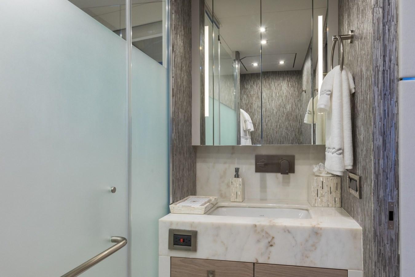 a bathroom with a sink and mirror aboard G-G Yacht for Sale
