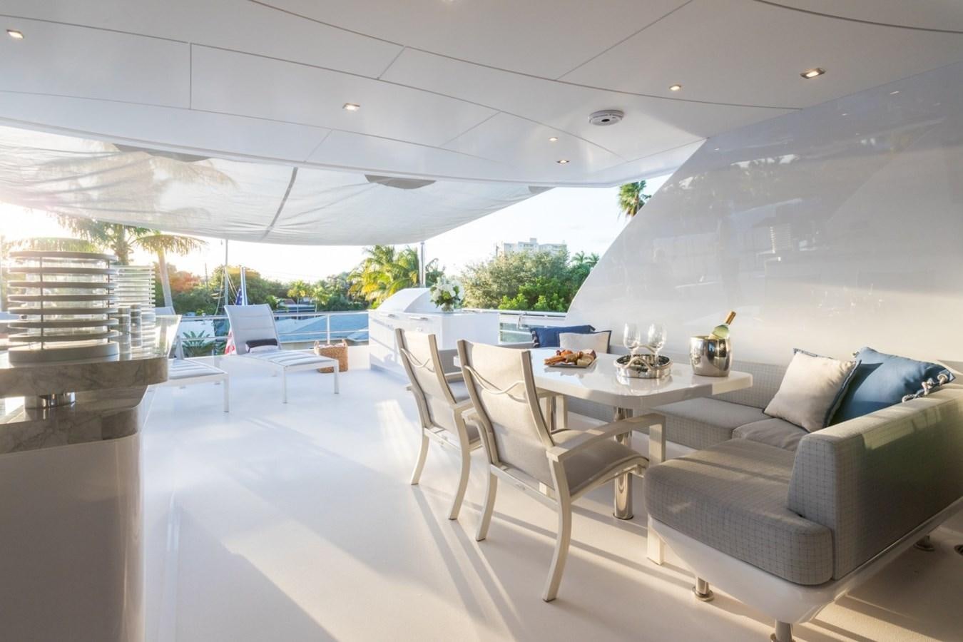 a room with a couch and a table aboard G-G Yacht for Sale