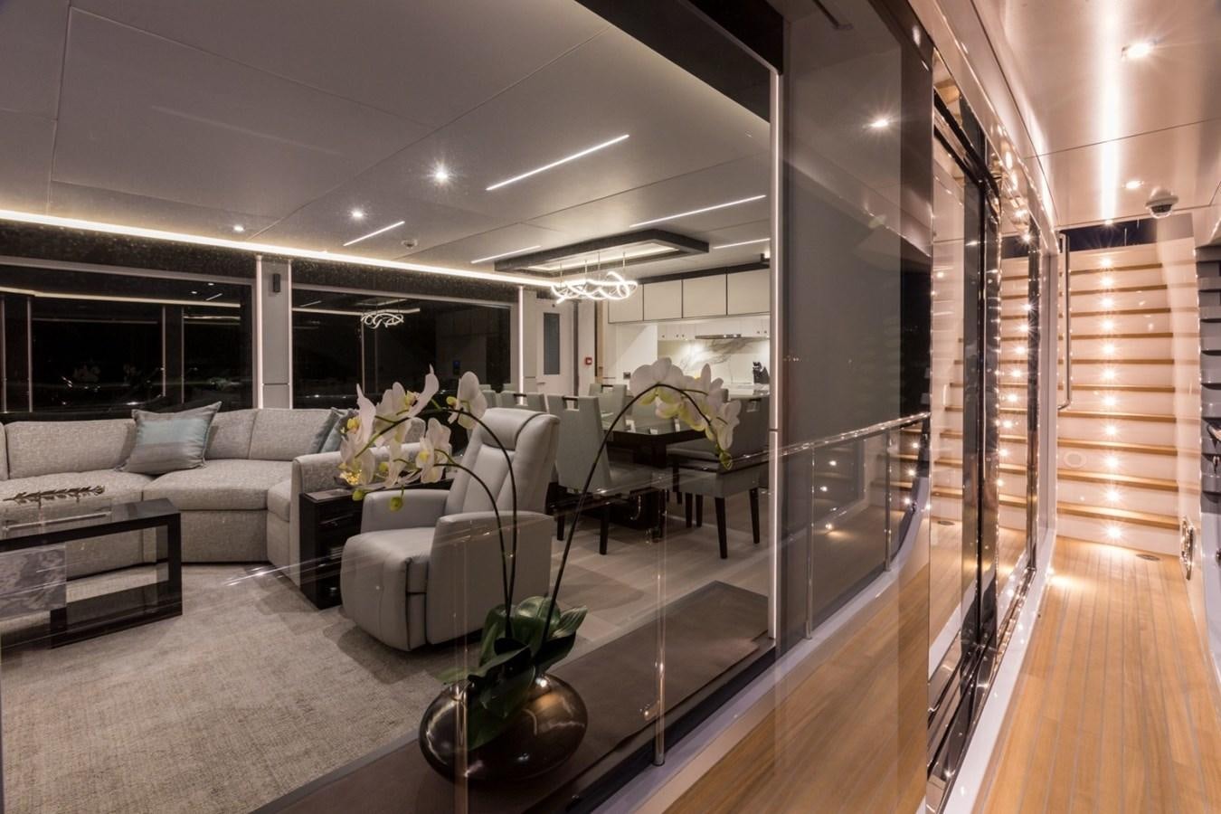 a living room with a wood floor aboard G-G Yacht for Sale