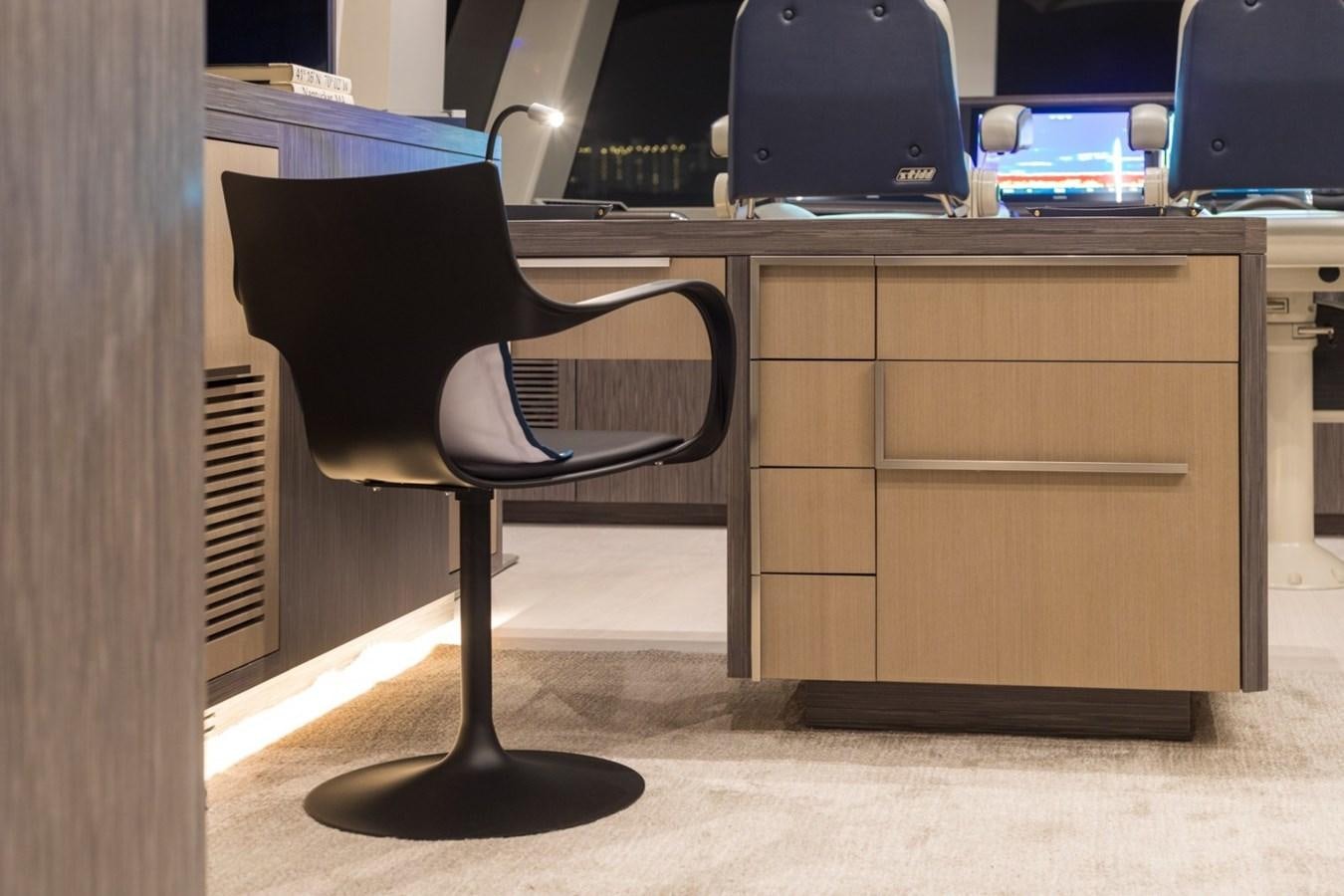 a chair in front of a desk aboard G-G Yacht for Sale