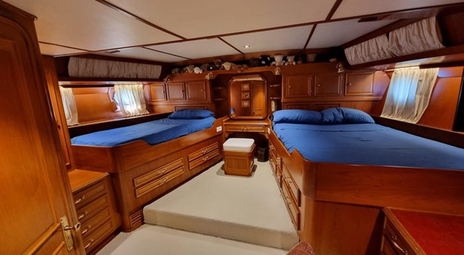 a room with bunk beds aboard ACOA Yacht for Sale