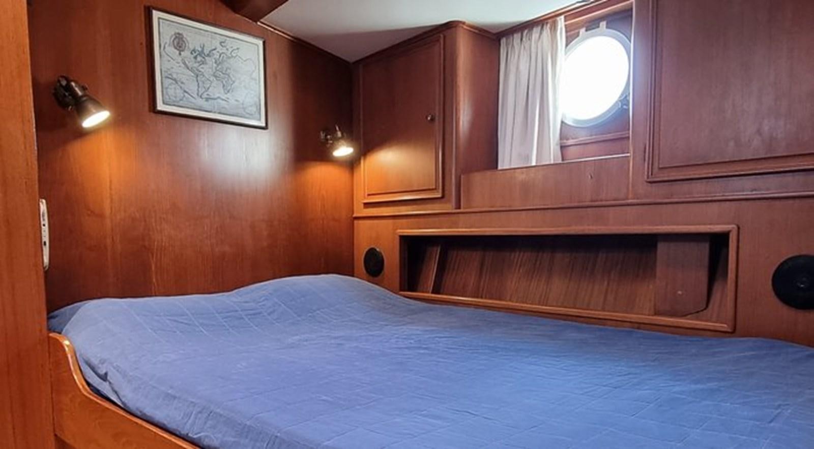a bed with a white sheet aboard ACOA Yacht for Sale