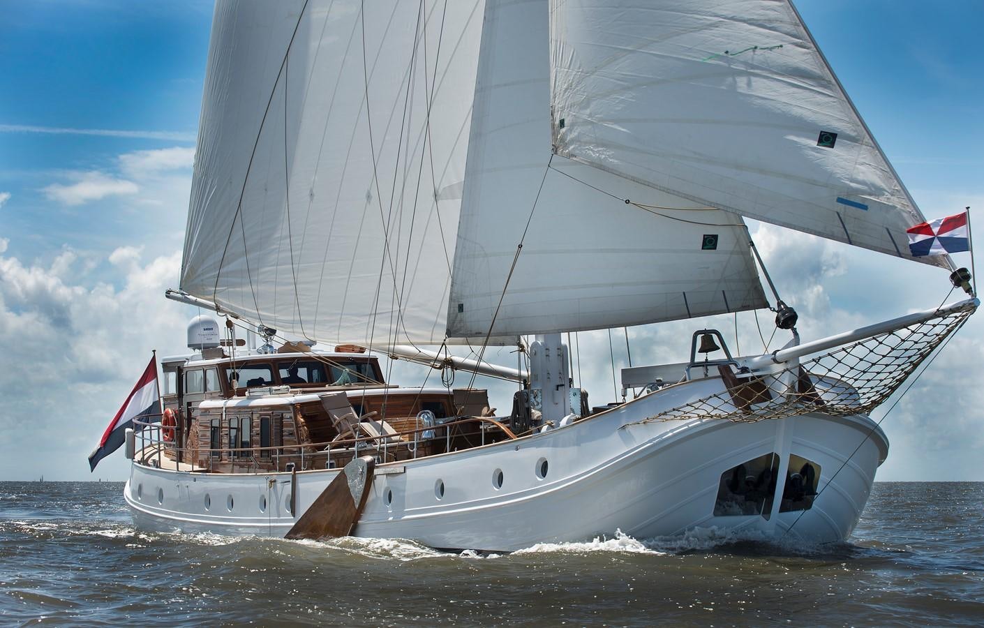 a boat in the water aboard DE VROUWE CHRISTINA Yacht for Sale