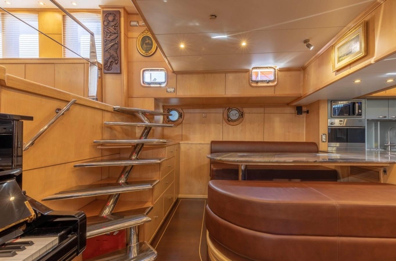 a kitchen with wooden cabinets aboard DE VROUWE CHRISTINA Yacht for Sale