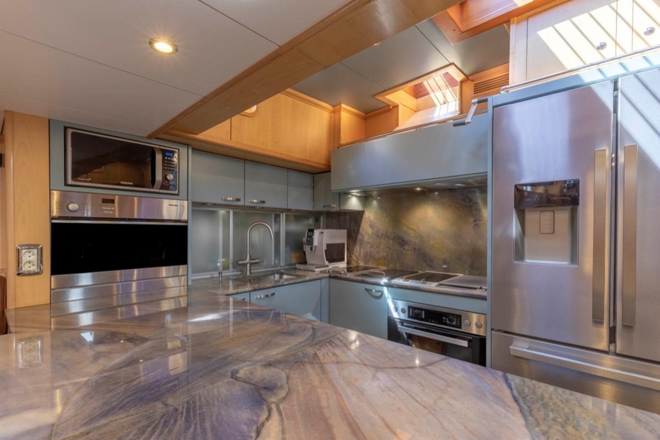 a large kitchen with stainless steel appliances aboard DE VROUWE CHRISTINA Yacht for Sale