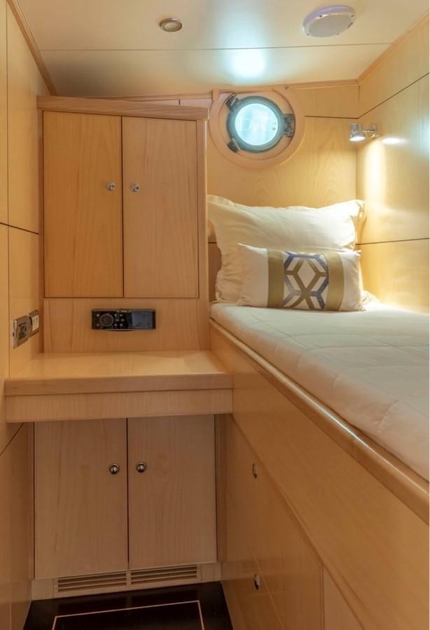 a room with a bed and a mirror aboard DE VROUWE CHRISTINA Yacht for Sale