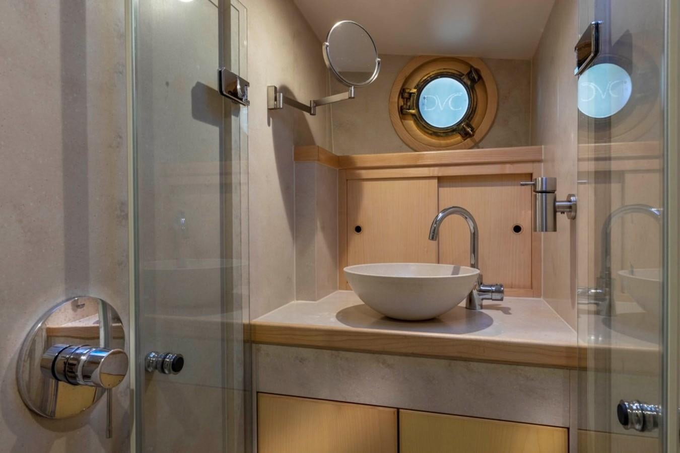 a bathroom with a sink and a mirror aboard DE VROUWE CHRISTINA Yacht for Sale