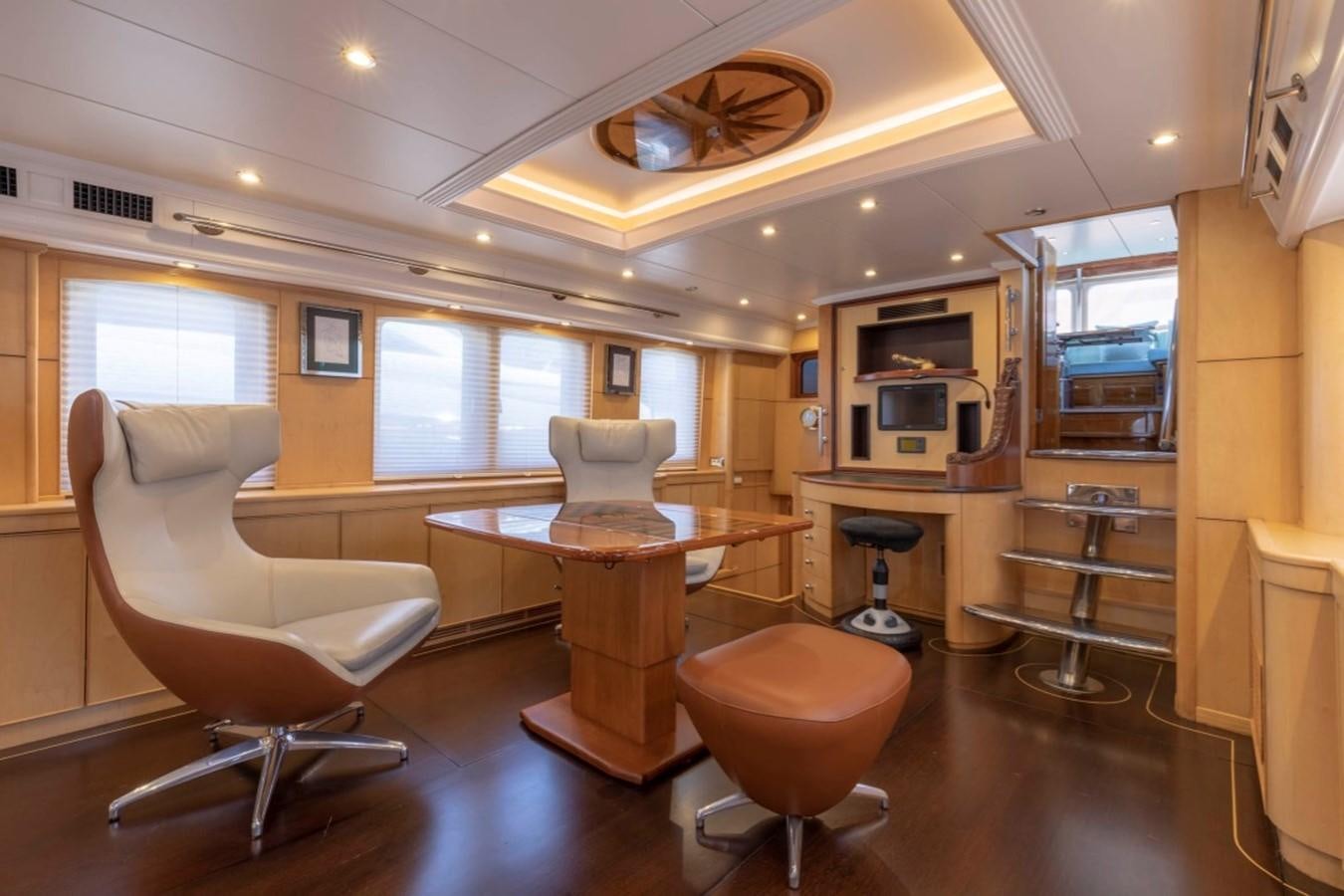 a room with a table and chairs aboard DE VROUWE CHRISTINA Yacht for Sale