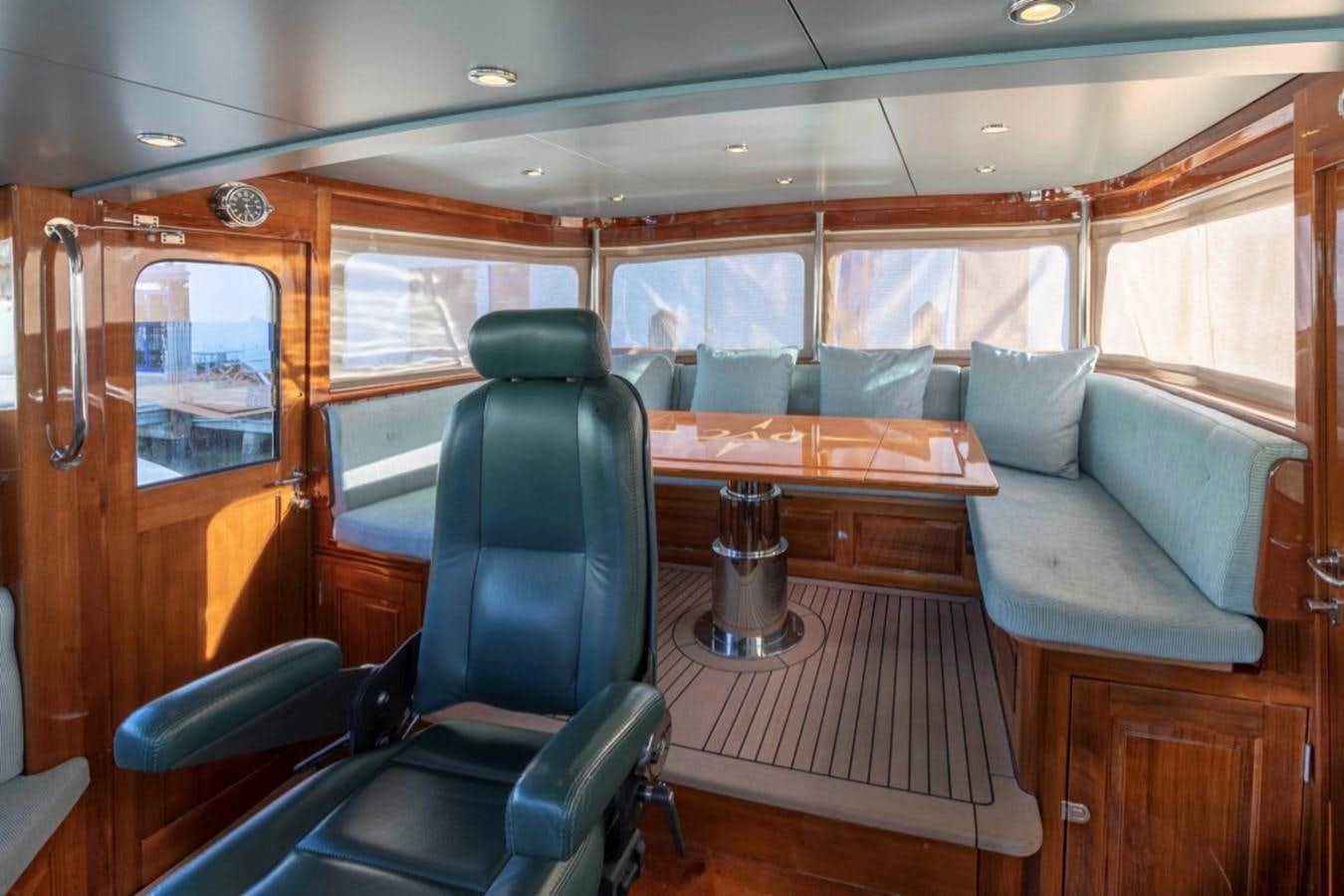 a train car with a table and chairs aboard DE VROUWE CHRISTINA Yacht for Sale
