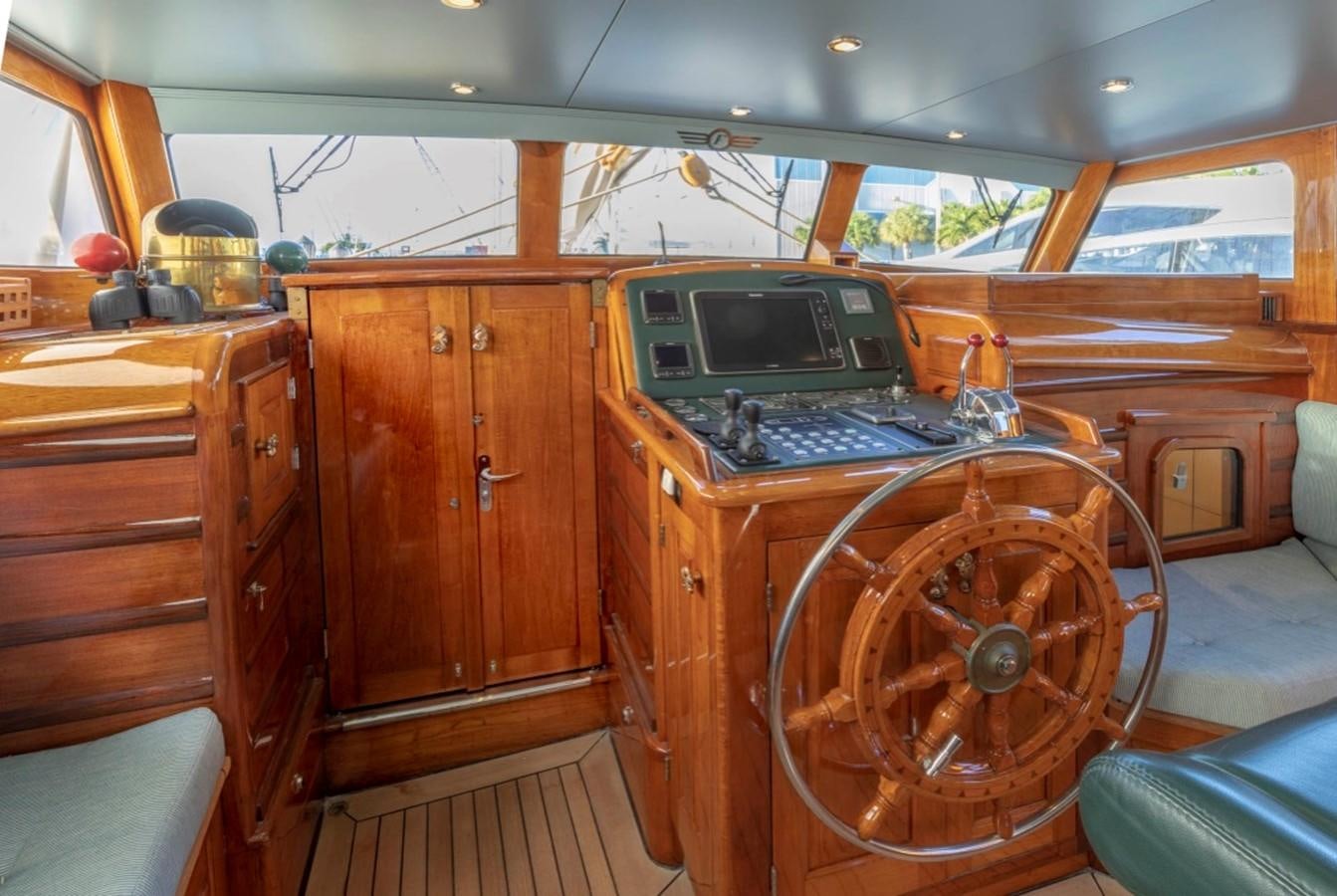 a wooden cabin with a computer and a desk aboard DE VROUWE CHRISTINA Yacht for Sale