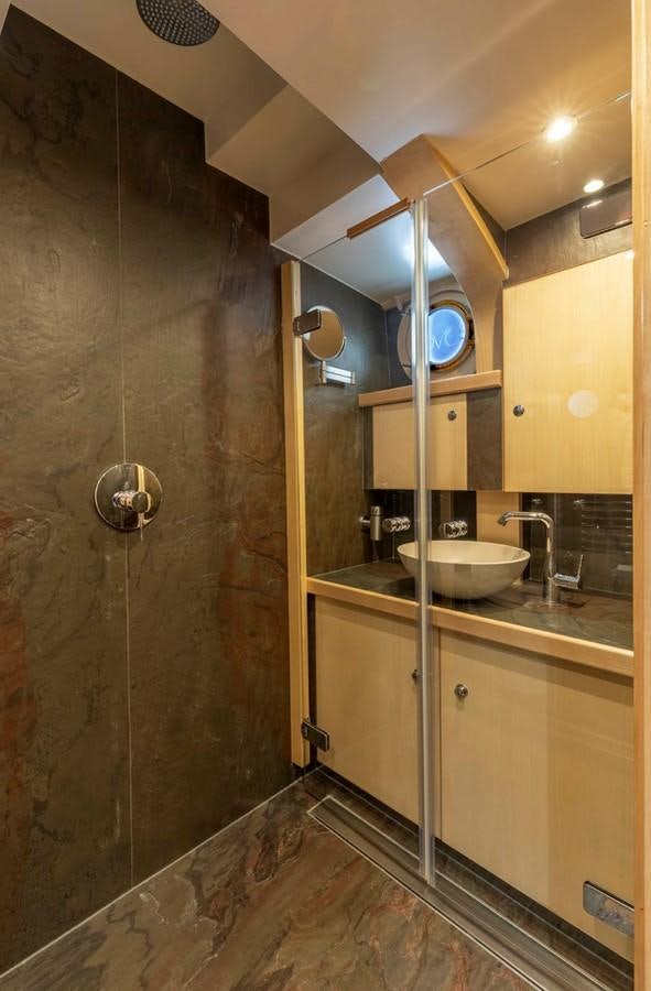 a bathroom with a sink and a mirror aboard DE VROUWE CHRISTINA Yacht for Sale