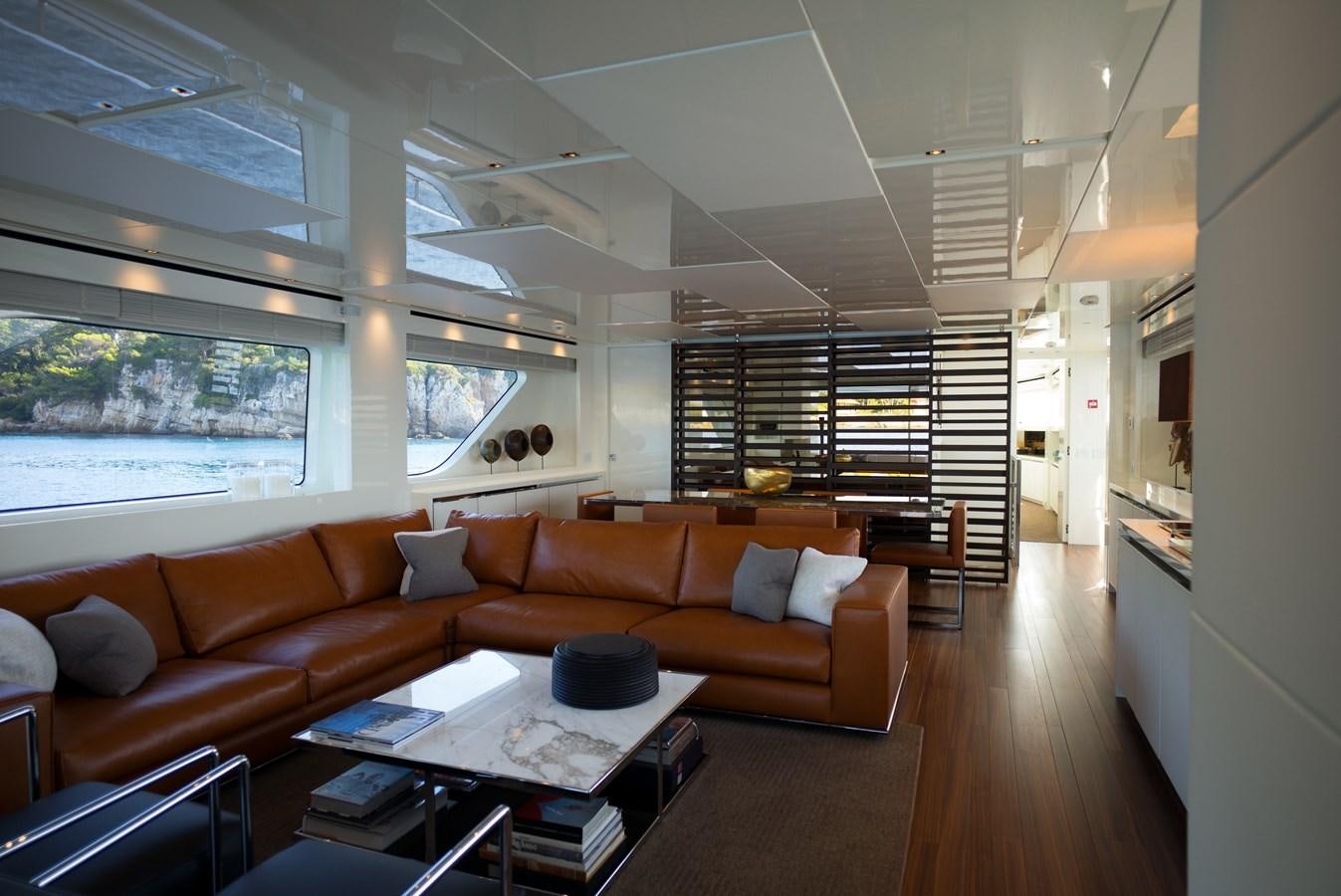 a living room with a couch and a table aboard ELMO Yacht for Sale