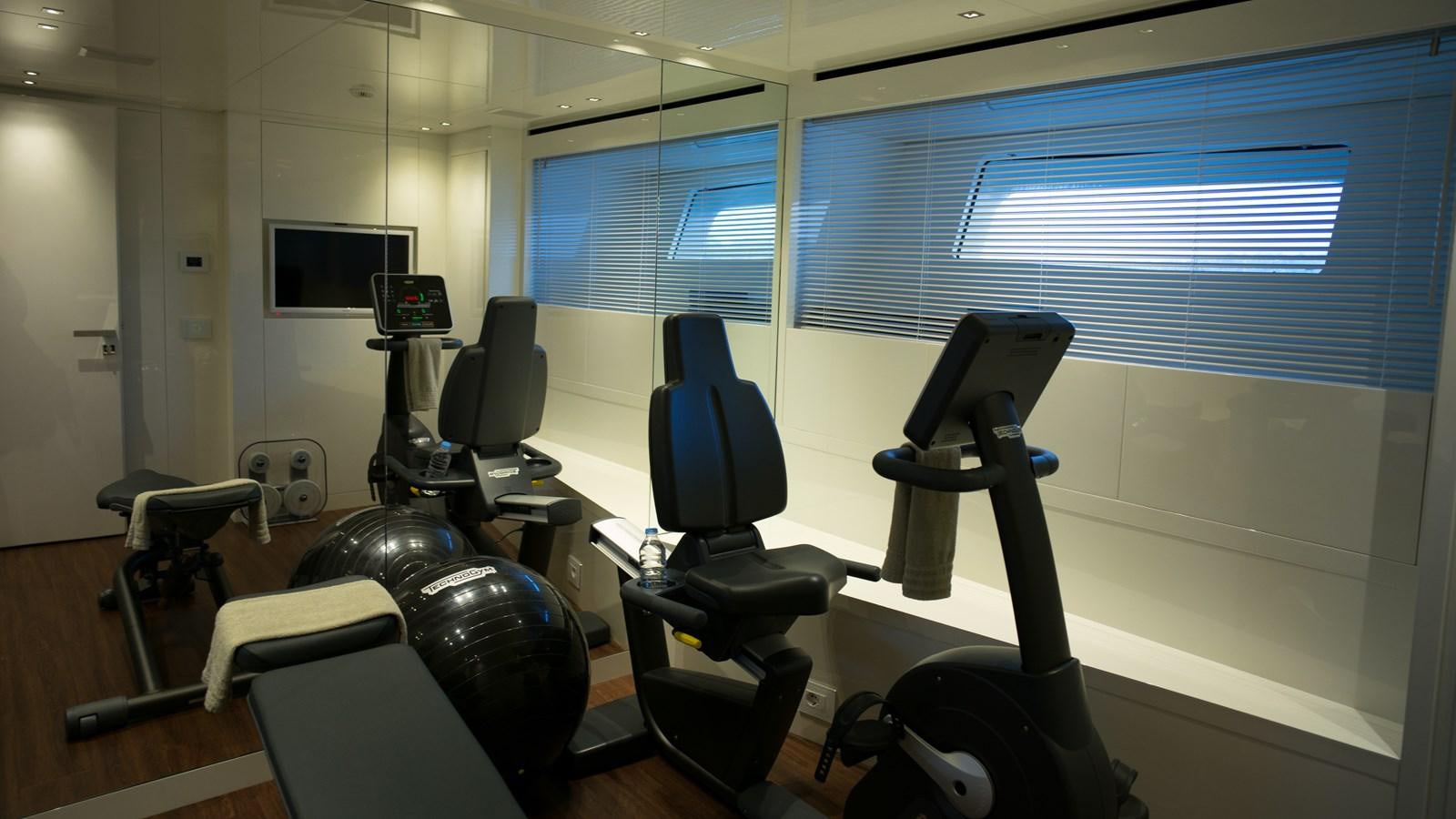 a room with many exercise equipment aboard ELMO Yacht for Sale