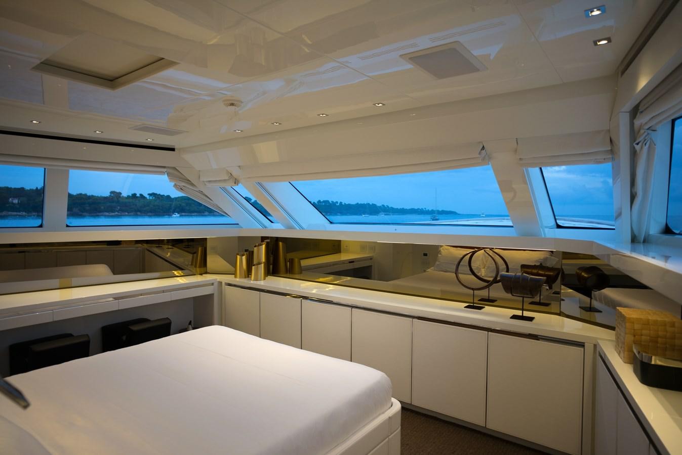 a room with a bed and desk aboard ELMO Yacht for Sale