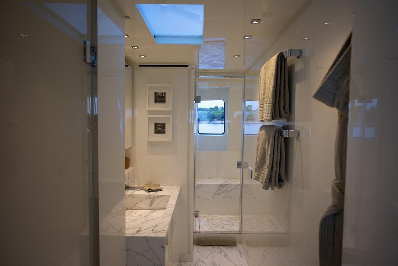 a bathroom with a glass shower aboard ELMO Yacht for Sale