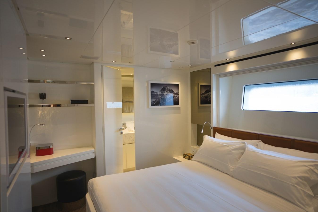 a room with a bed and a desk aboard ELMO Yacht for Sale
