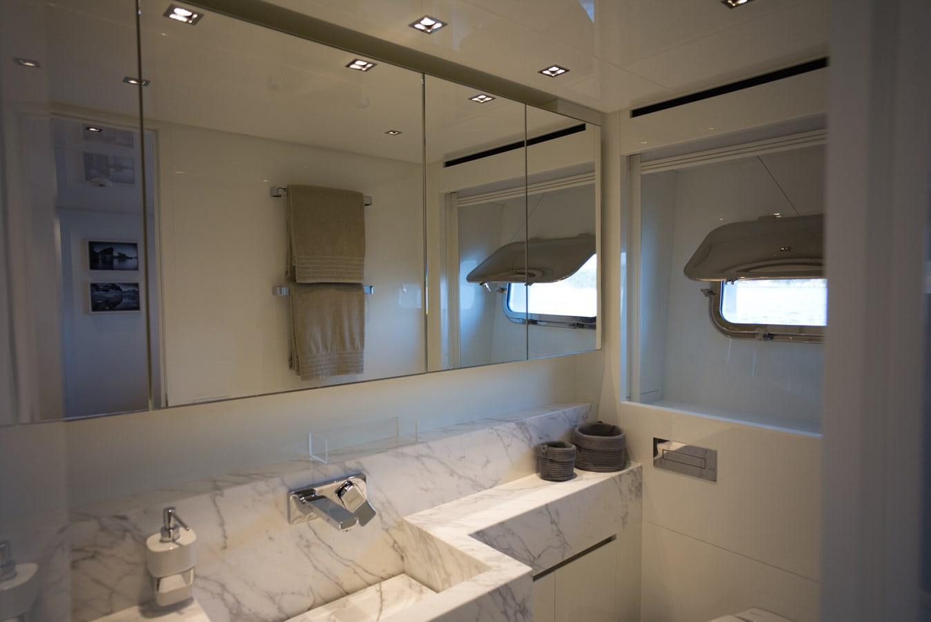 a bathroom with a large mirror aboard ELMO Yacht for Sale