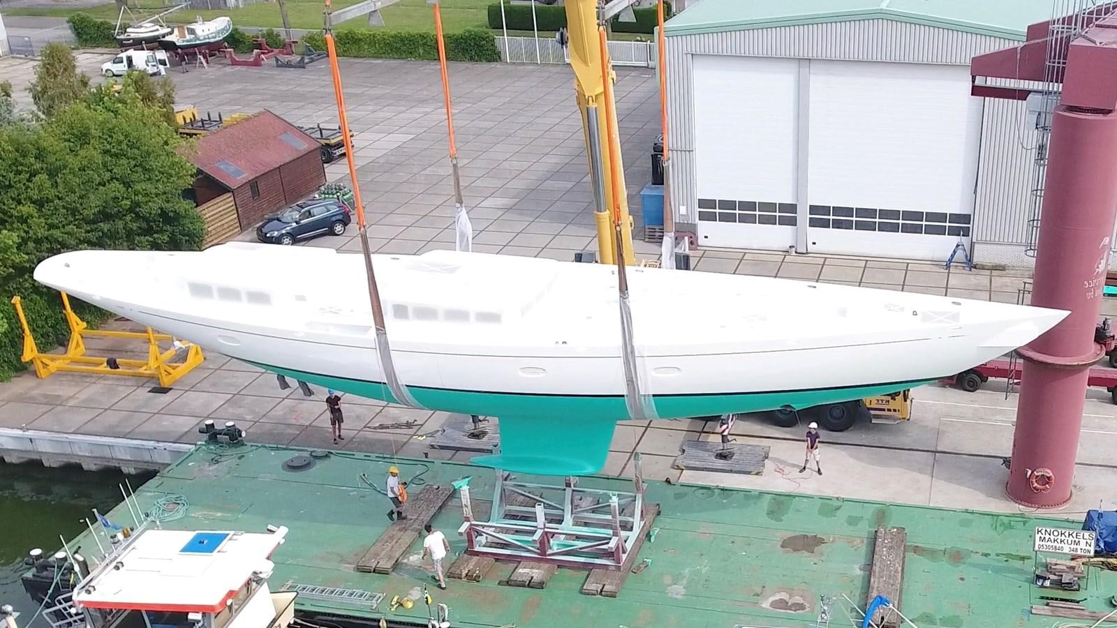 a large white boat in a yard aboard TC 90 HULL # 4 Yacht for Sale