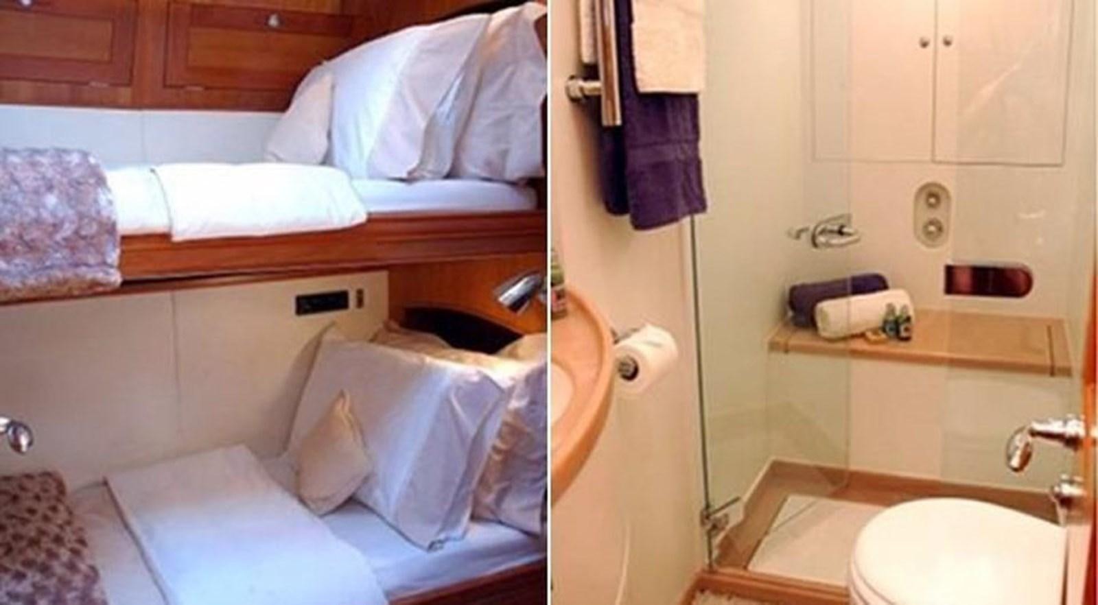 a bathroom with a bed and a sink aboard DARK STAR OF LONDON Yacht for Sale