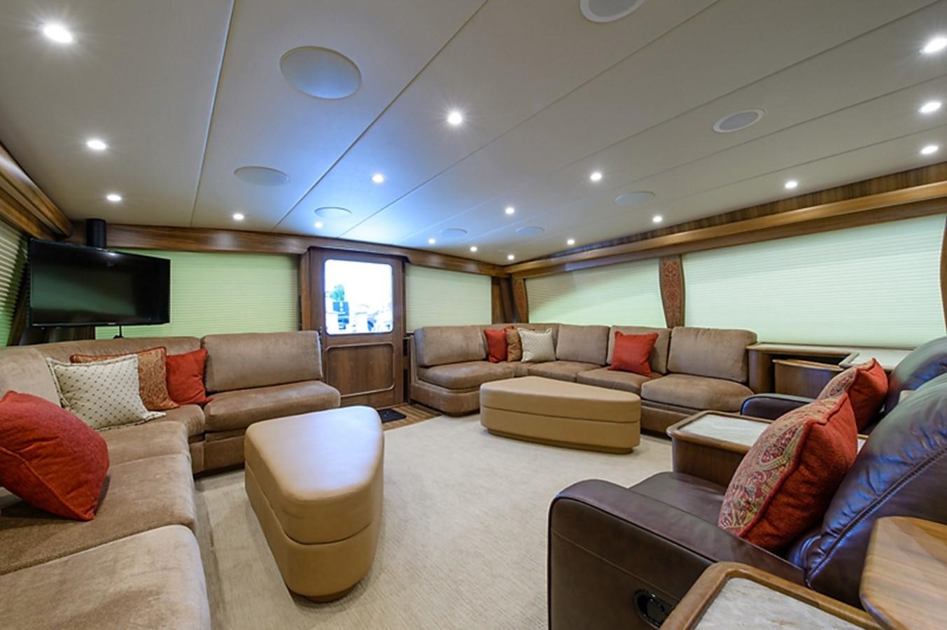 a living room with a large window aboard BANGARANG Yacht for Sale