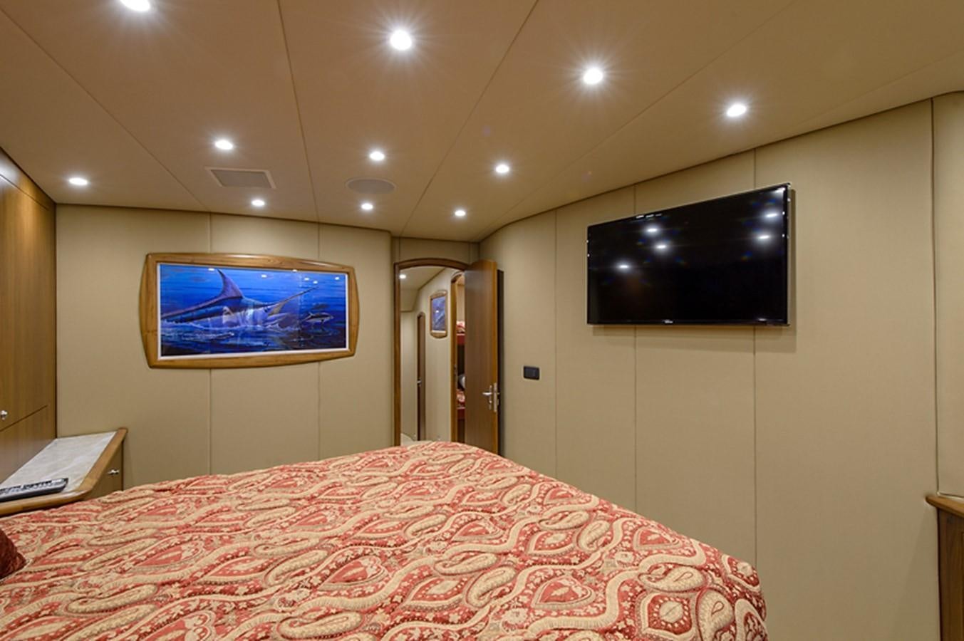 a hotel room with a large bed aboard BANGARANG Yacht for Sale